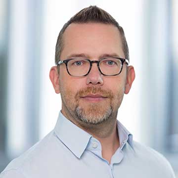 A portrait of Oliver Bischof.